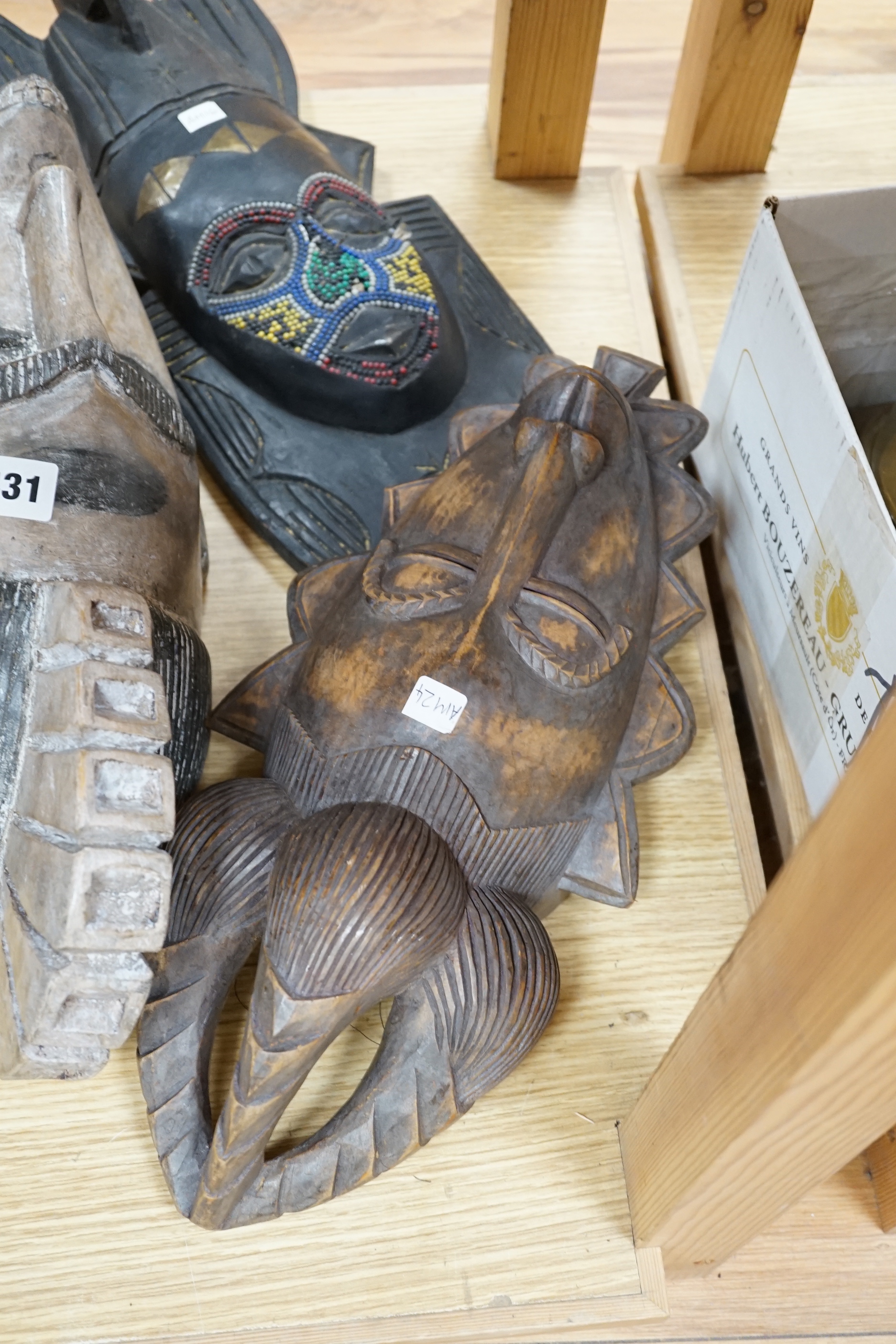 Six assorted carved African tribal masks, including Fang, Ashanti etc. largest 43cms long